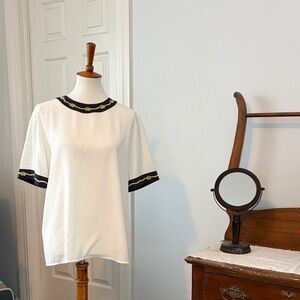 Chic White Blouse with Navy Trim